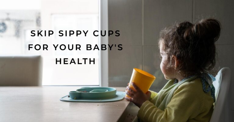 Baby drinking from an open cup